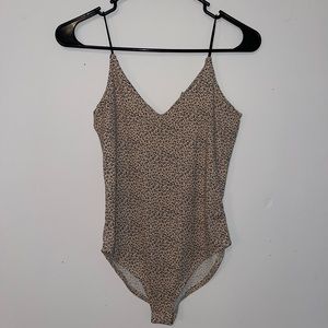 BODYSUIT. Cheetah print body suit